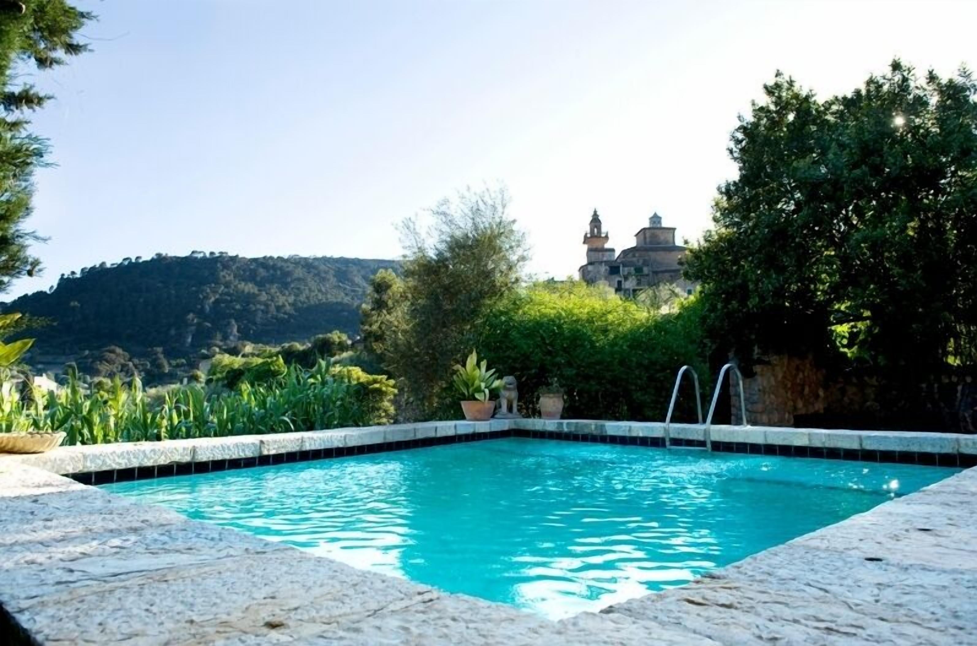 outdoor pool, pool umbrellas, pool loungers