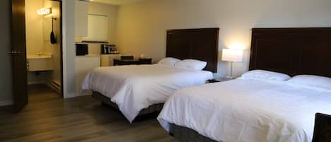 Deluxe Queen Room with Two Queen Beds | Desk, laptop workspace, free WiFi, bed sheets