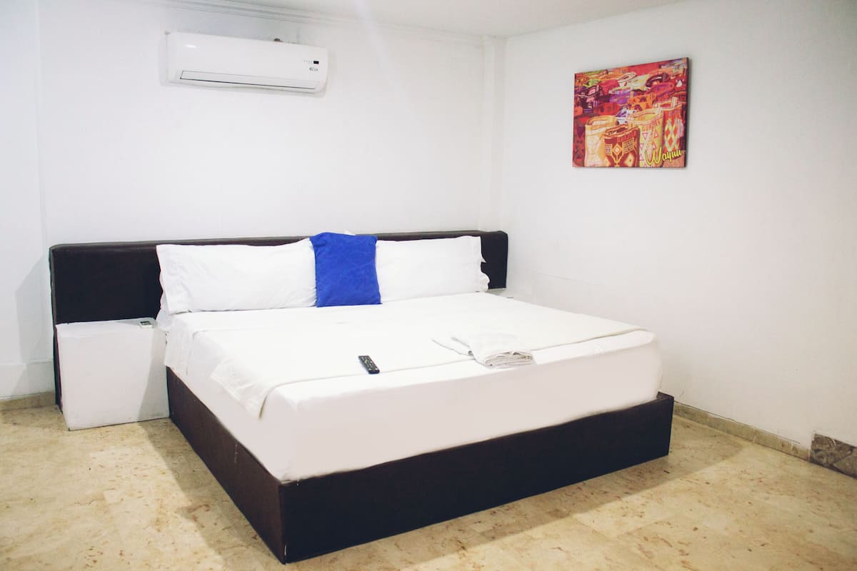 Double Room | Minibar, in-room safe, iron/ironing board, bed sheets
