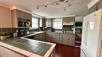 Suite, 2 Bedrooms | Private kitchen | Coffee/tea maker, mini-fridge, microwave