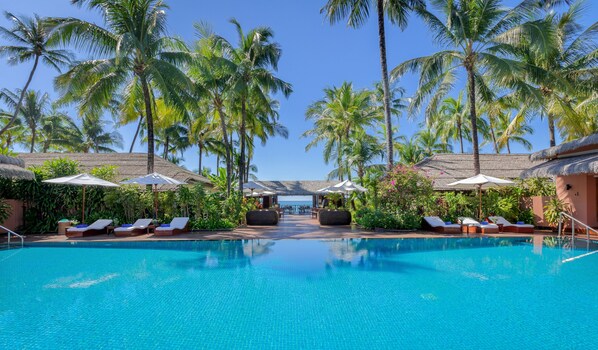 Outdoor pool, open 7 AM to 7 PM, pool umbrellas, pool loungers