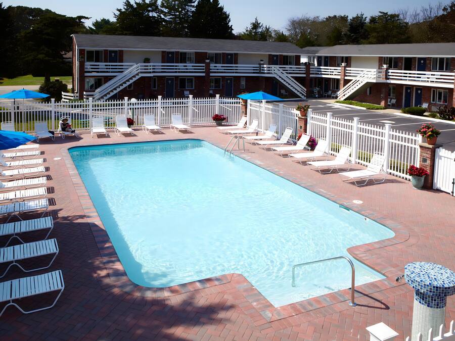 Seasonal outdoor pool, open 9:00 AM to 8:00 PM, pool loungers