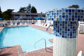 Seasonal outdoor pool, open 9:00 AM to 8:00 PM, pool loungers
