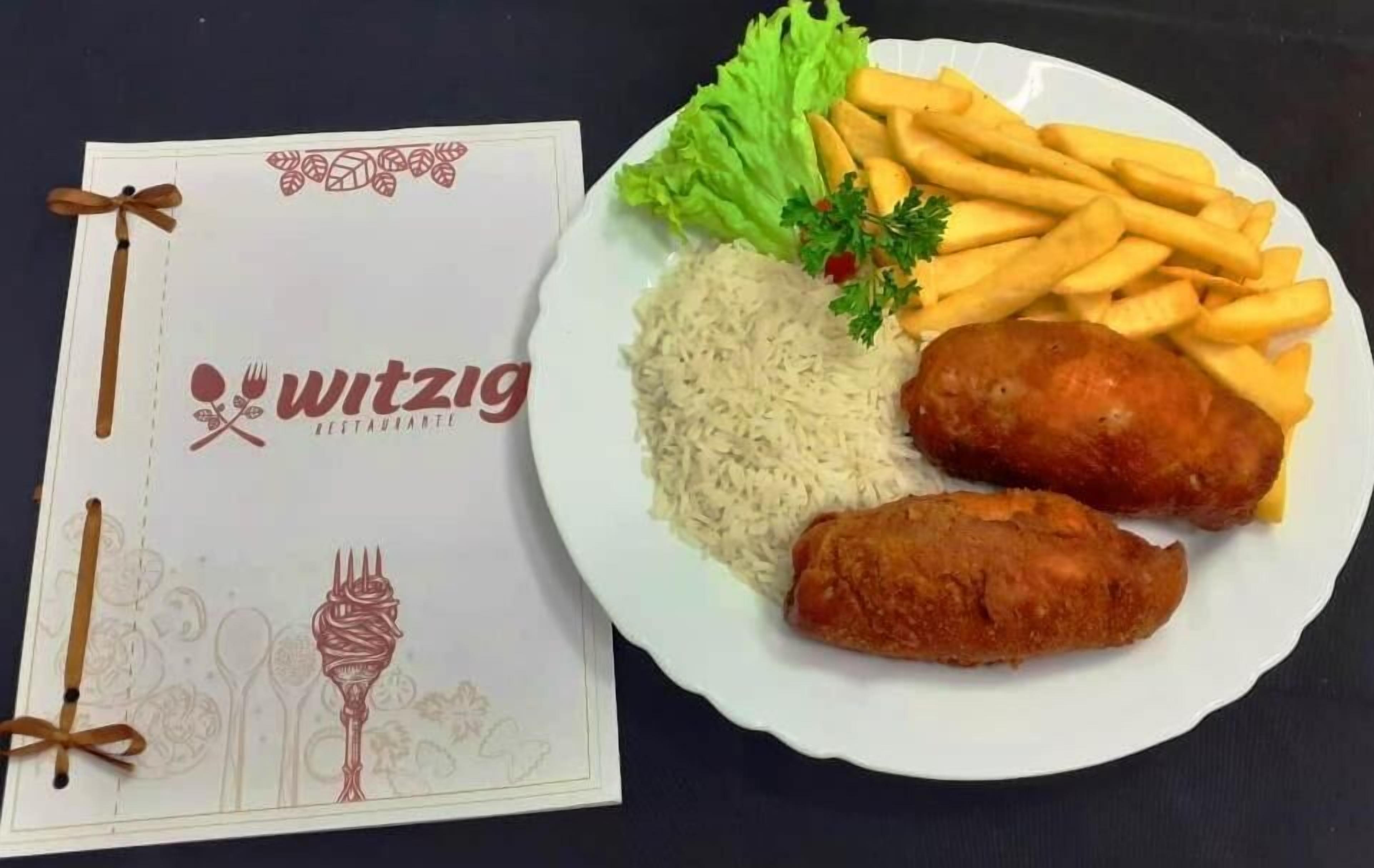 Un menú con el nombre 'Witzig' y un plato de arroz, papas fritas y dos preparaciones fritas, posiblemente pescado, decorado con perejil.