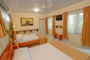 Deluxe Quadruple Room | Desk, blackout drapes, free WiFi, bed sheets