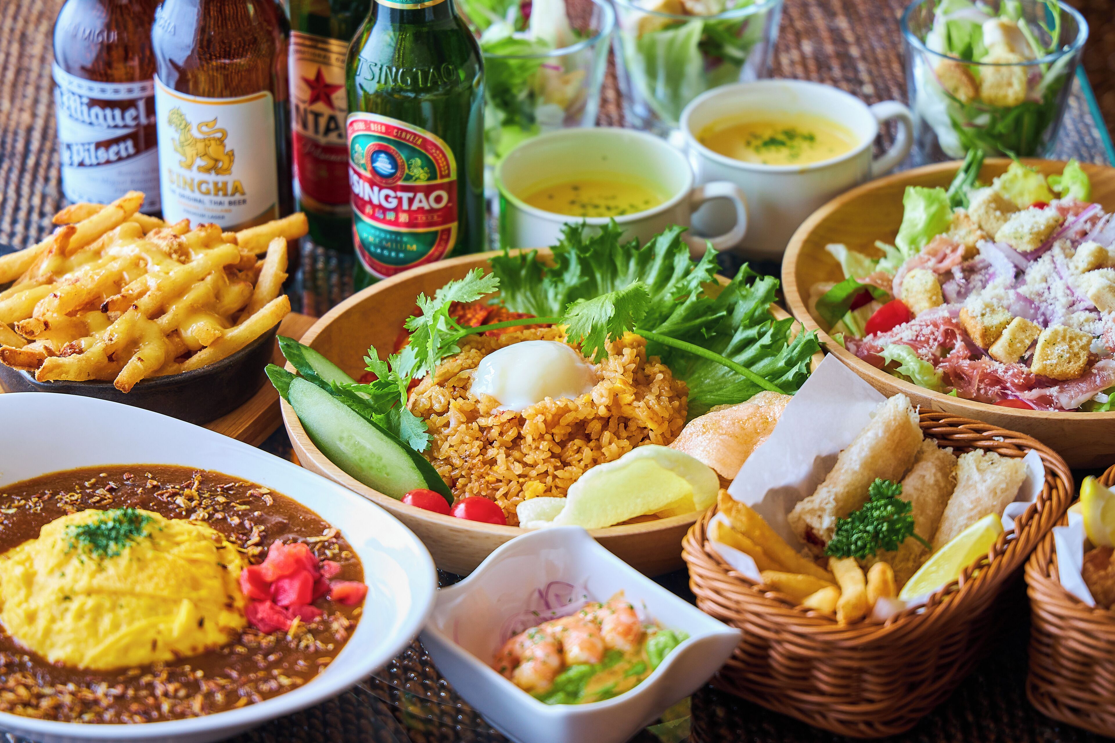 A variety of dishes including fried rice, a salad, and a bowl of soup.