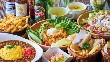 A variety of dishes including fried rice, a salad, and a bowl of soup.