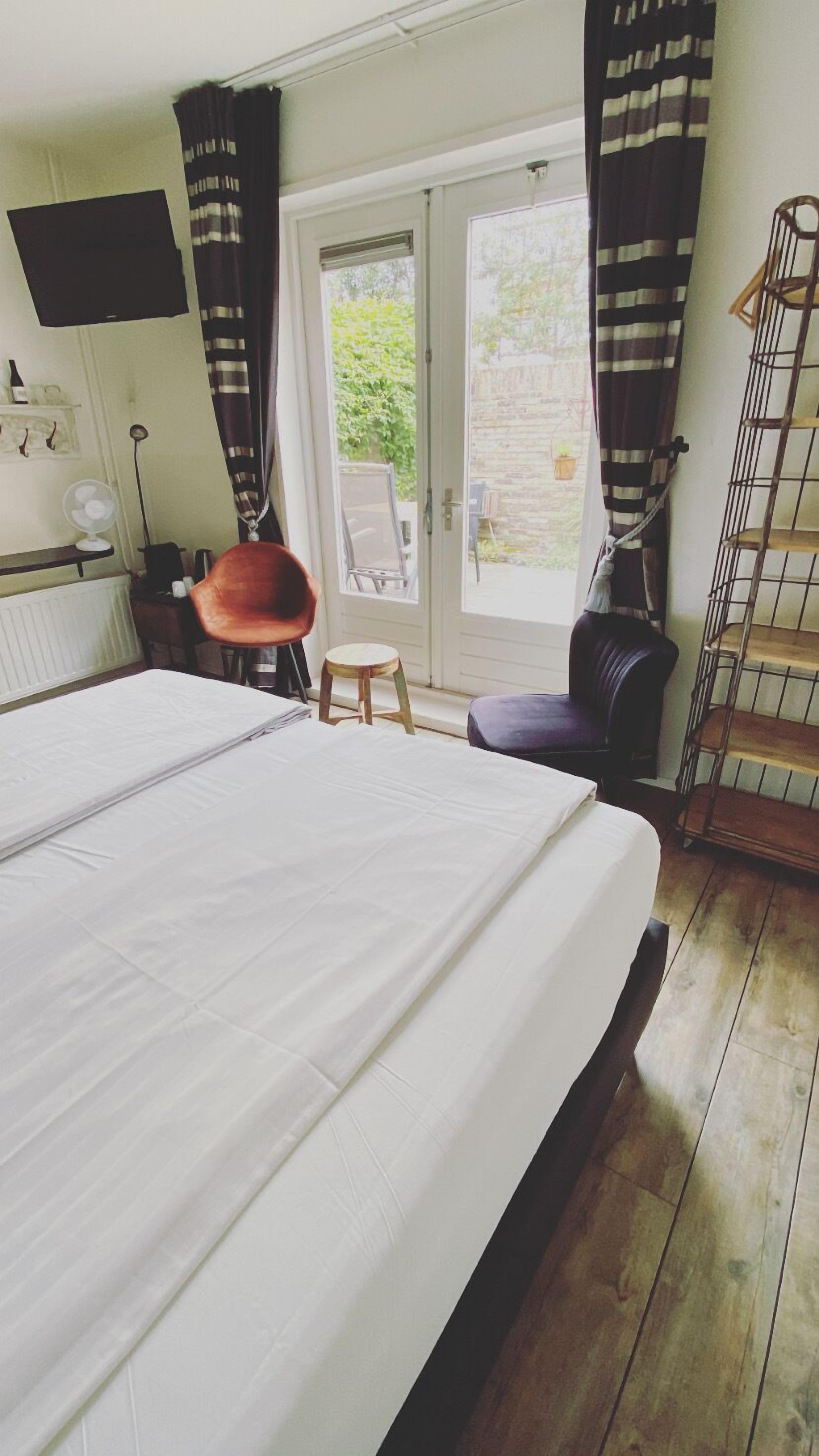 deluxe double room, private bathroom, garden view | premium bedding, minibar, individually decorated, individually furnished