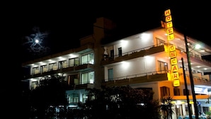 A multi-story hotel with a prominent 'HOTEL OSCA' sign, balconies, and a well-lit facade. - Oscar Hotel (Igoumenitsa)