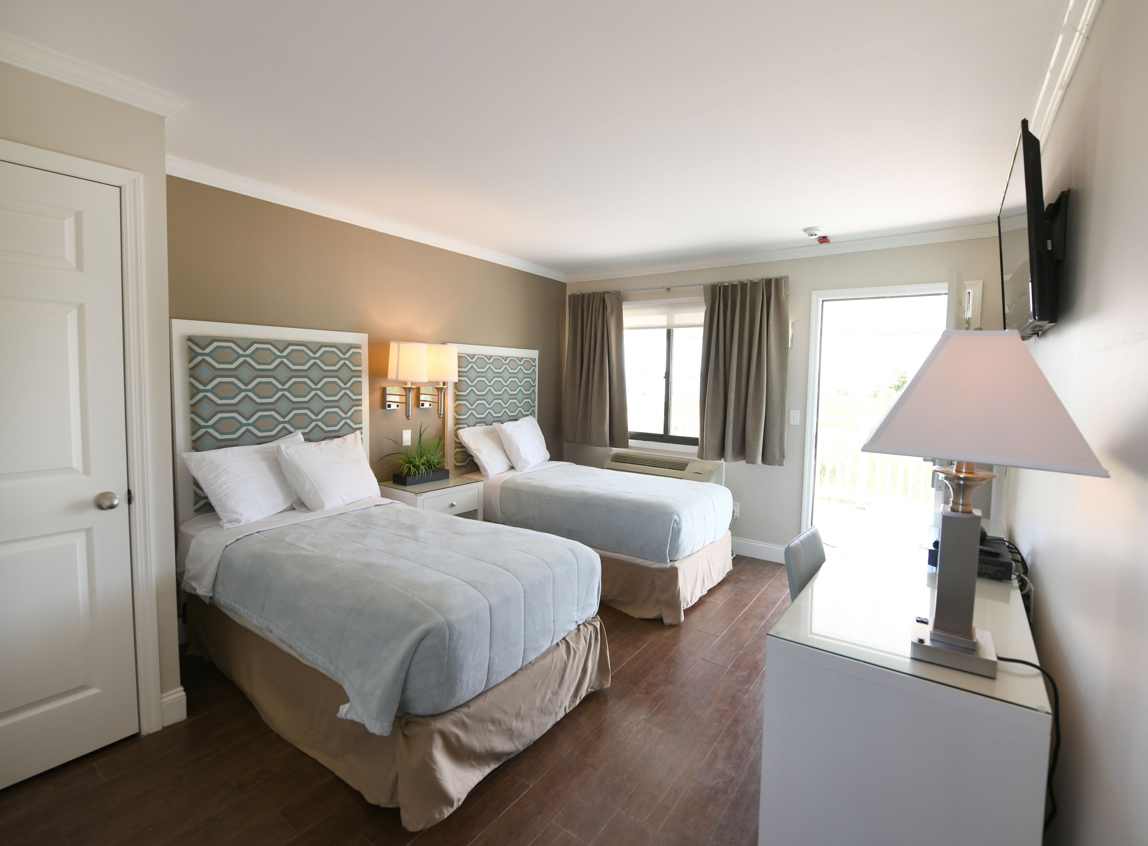 Waterview Twins | Individually decorated, desk, laptop workspace, blackout drapes