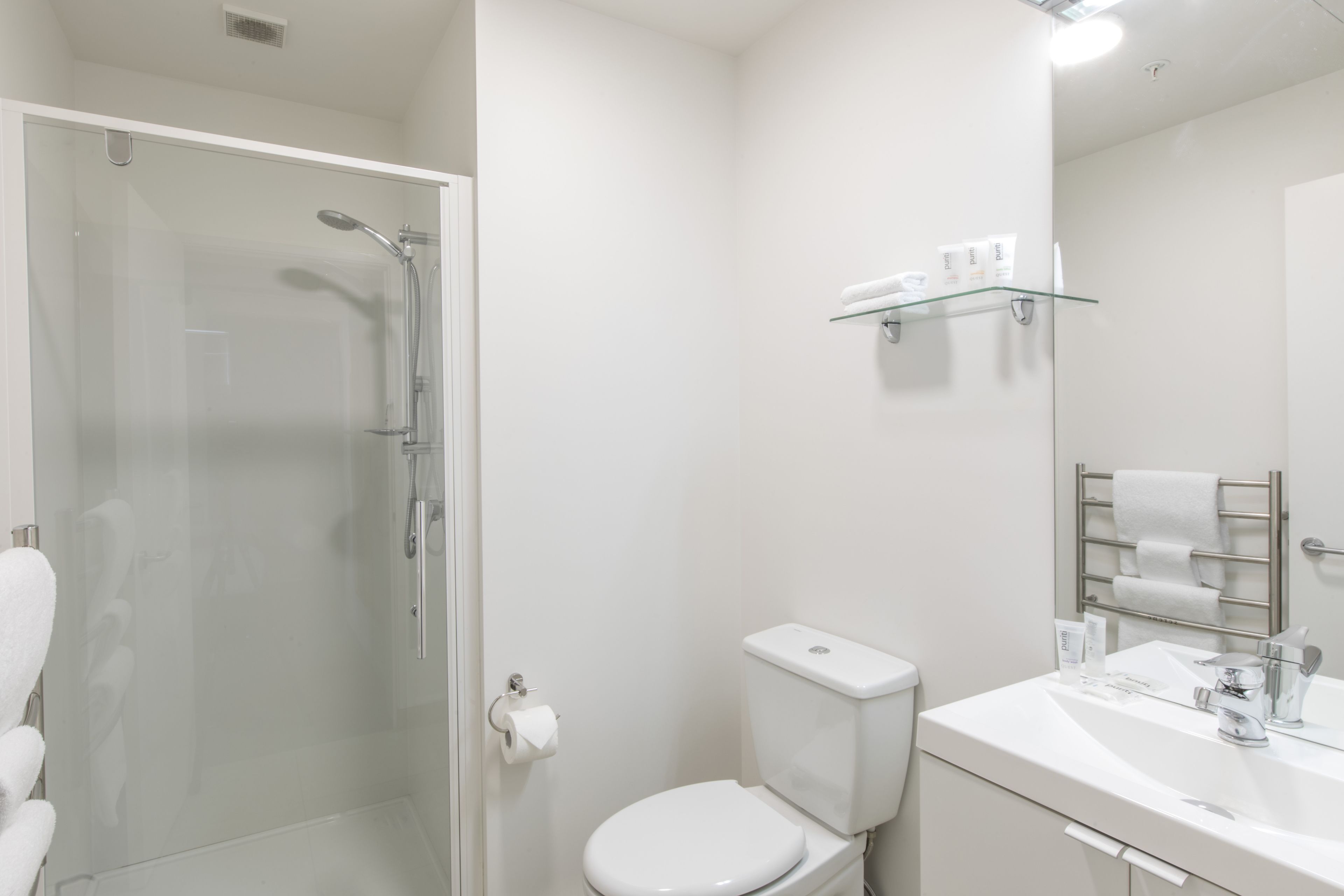 Shower, designer toiletries, hair dryer, towels