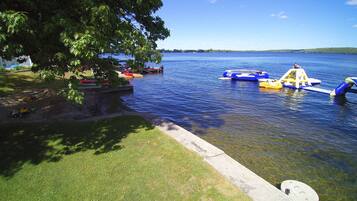 A lake with boats and a dock.