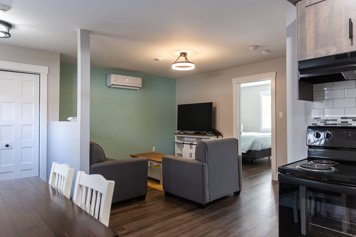 Family Apartment, Not Ocean Front | Living area | 60-inch flat-screen TV with cable channels, TV