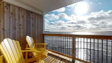 Signature Studio, 1 Queen Bed, Beachfront | Living area | 60-inch flat-screen TV with cable channels, TV