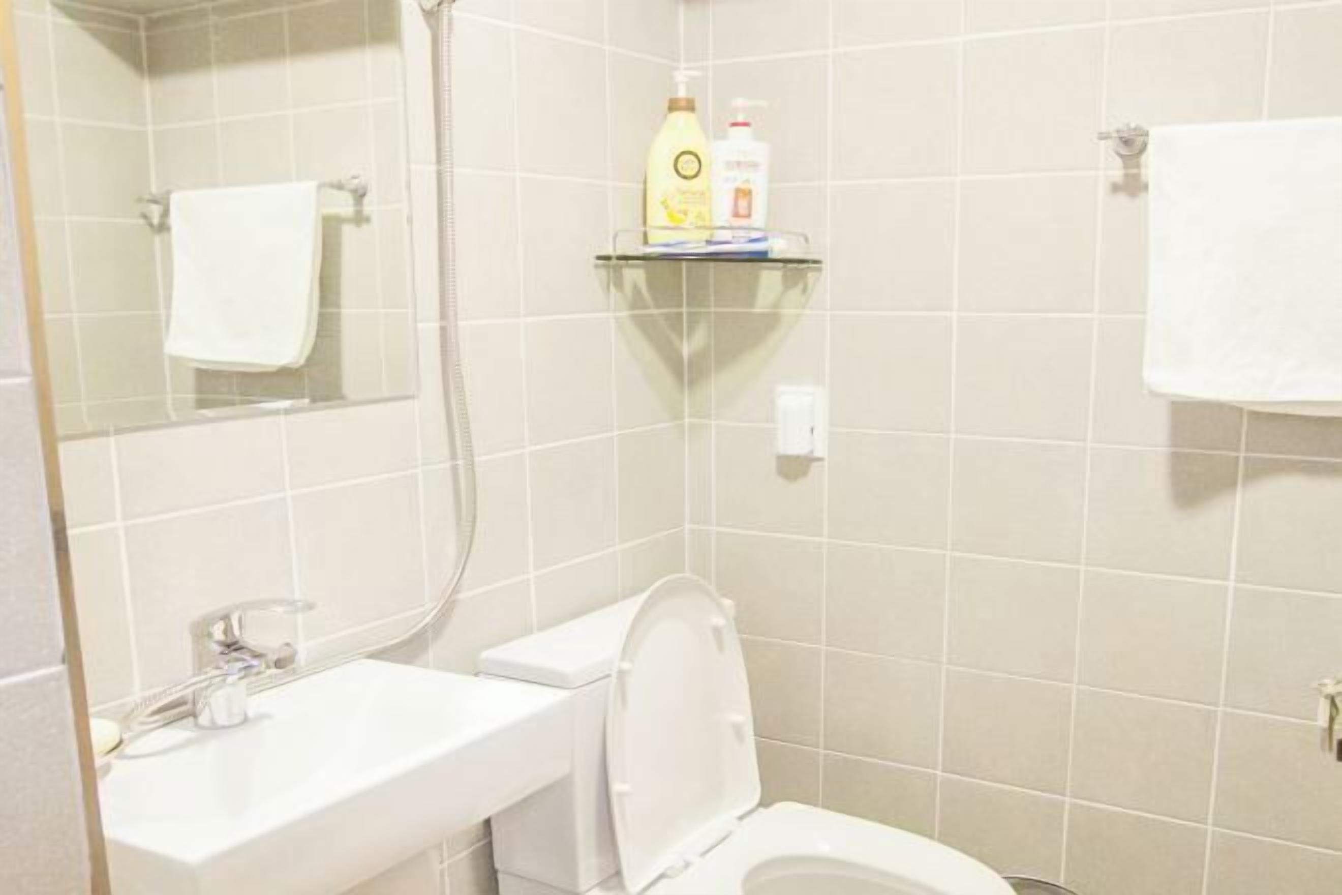 Bathroom | Shower, designer toiletries, hair dryer, slippers