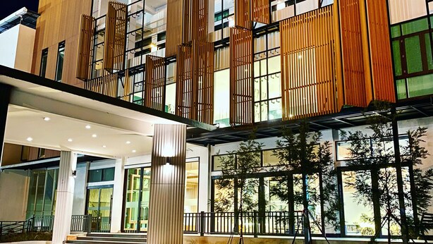 A modern hotel with a spacious lobby, large windows, and a well-lit entrance. - The Mantrini Chiang Rai (Chiang Rai)