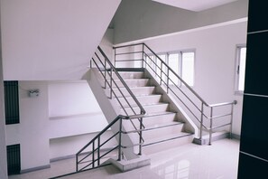 A staircase with metal railings and a tiled floor. - Golden On-nut (Bangkok)