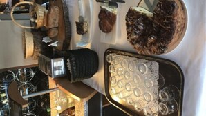 A buffet table with various food items and a selection of wine bottles. - SPA Hôtel Au Lion D'Or (La Petite-Pierre)