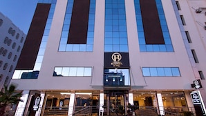 A modern hotel building with a prominent 'Business Hotels' sign. - Business Hotel Tunis (Tunis)