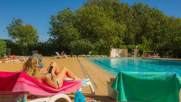 Seasonal outdoor pool, pool loungers