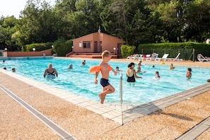 Seasonal outdoor pool, pool loungers