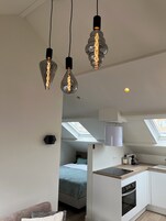 Deluxe Studio (Ground Floor) | Living area | Flat-screen TV