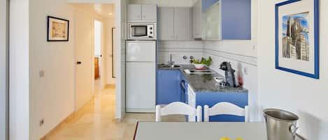 Apartment, 2 Bedrooms, Pool View | Private kitchen | Full-sized fridge, microwave, oven, stovetop