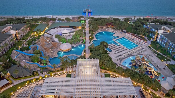 A resort with multiple swimming pools, a large central pool, and a water park. - DOBEDAN WORLD PALACE - All inclusive (Kemer)