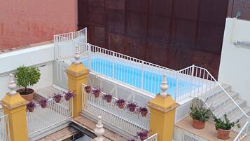Outdoor pool, pool umbrellas, pool loungers