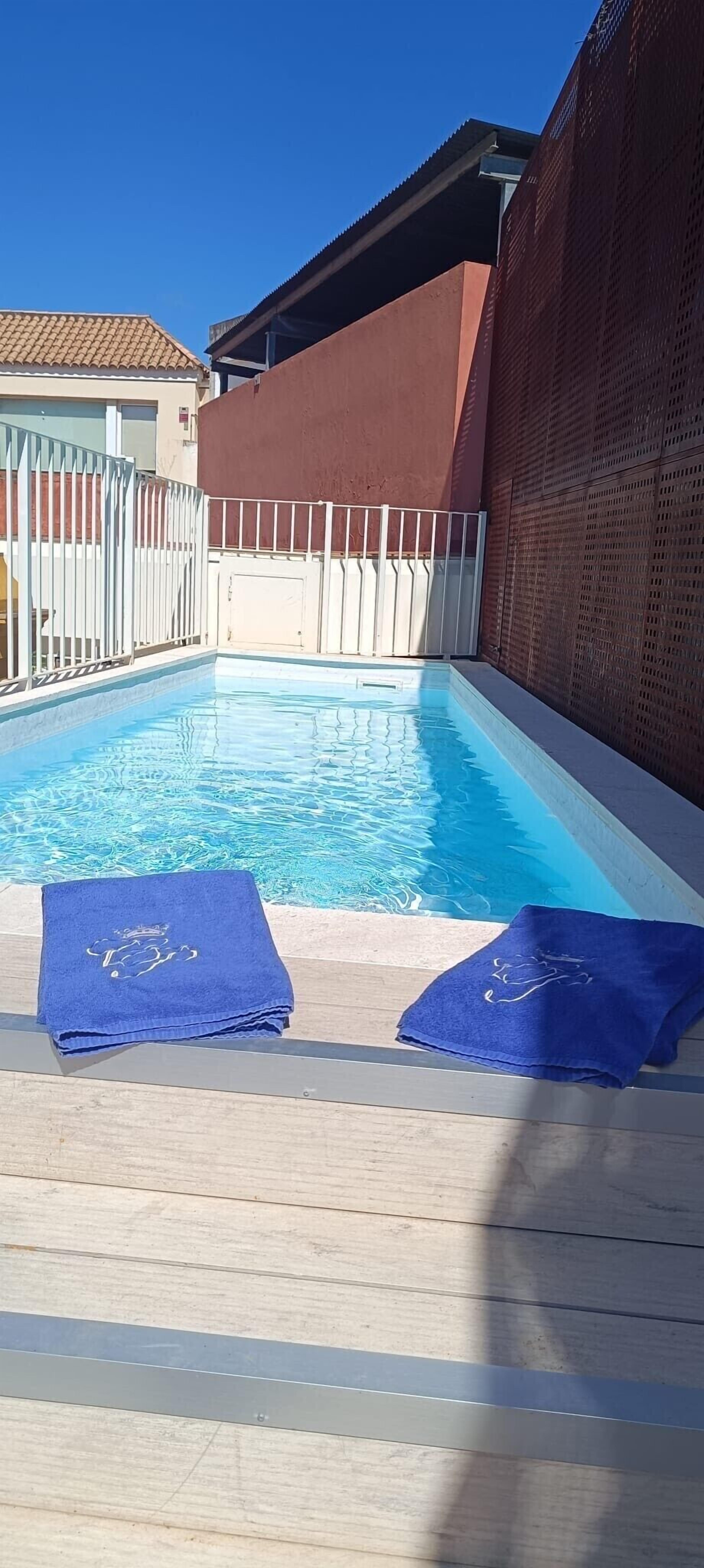 outdoor pool, pool umbrellas, pool loungers