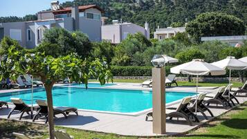 Outdoor pool, pool umbrellas, pool loungers