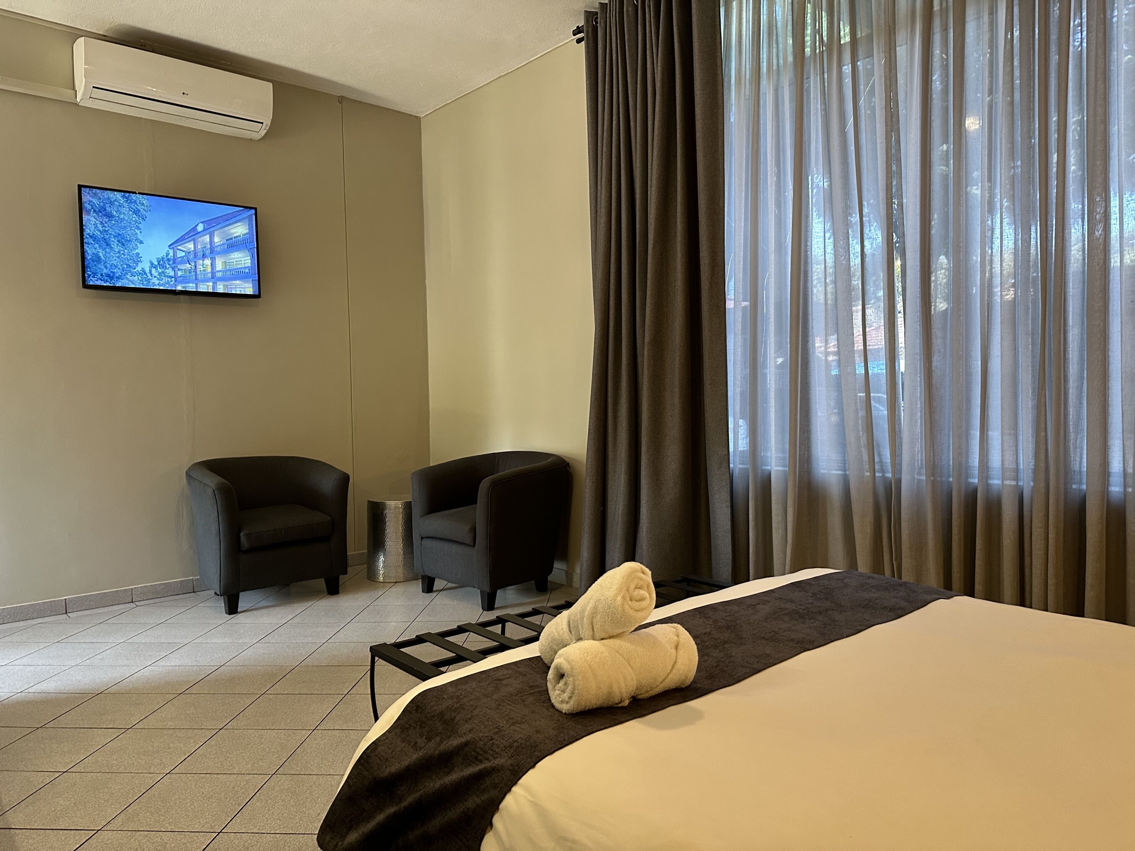 superior double room | in-room safe, desk, laptop workspace, blackout curtains