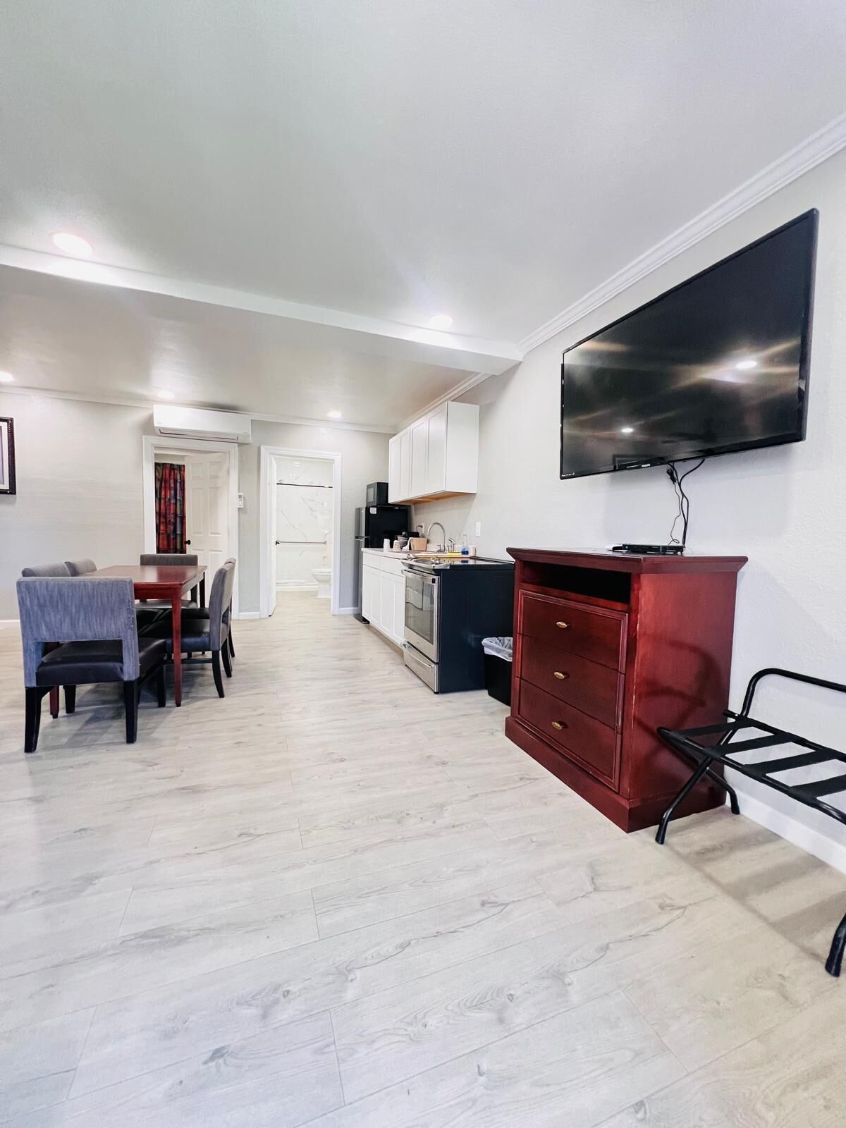 Deluxe Family Room, Two Bedrooms Apartments | Living area | Flat-screen TV