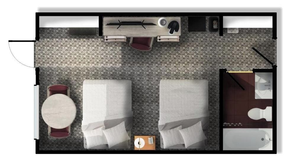 A hotel room layout with two beds, a round table, a small seating area, a bathroom, and a kitchenette.
