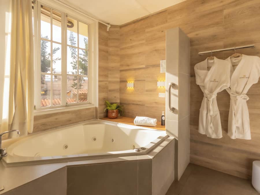 Superior Room, 2 Bedrooms | Bathroom | Combined shower/tub, deep soaking tub, hair dryer, towels
