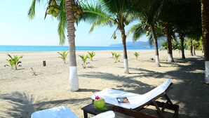 On the beach, sun loungers