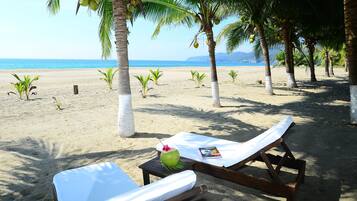 On the beach, sun-loungers