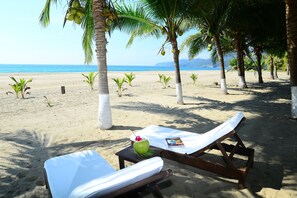 On the beach, sun loungers