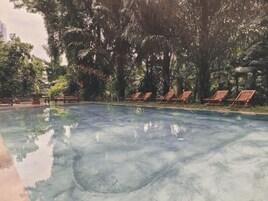 Outdoor pool, open 7:00 AM to 10:00 PM, sun loungers