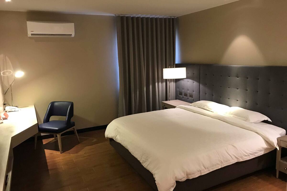 deluxe single room | in-room safe, desk, blackout curtains, rollaway beds