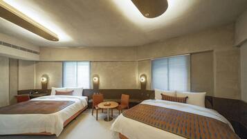 Deluxe Quadruple Room, City View | Down comforters, desk, soundproofing, iron/ironing board