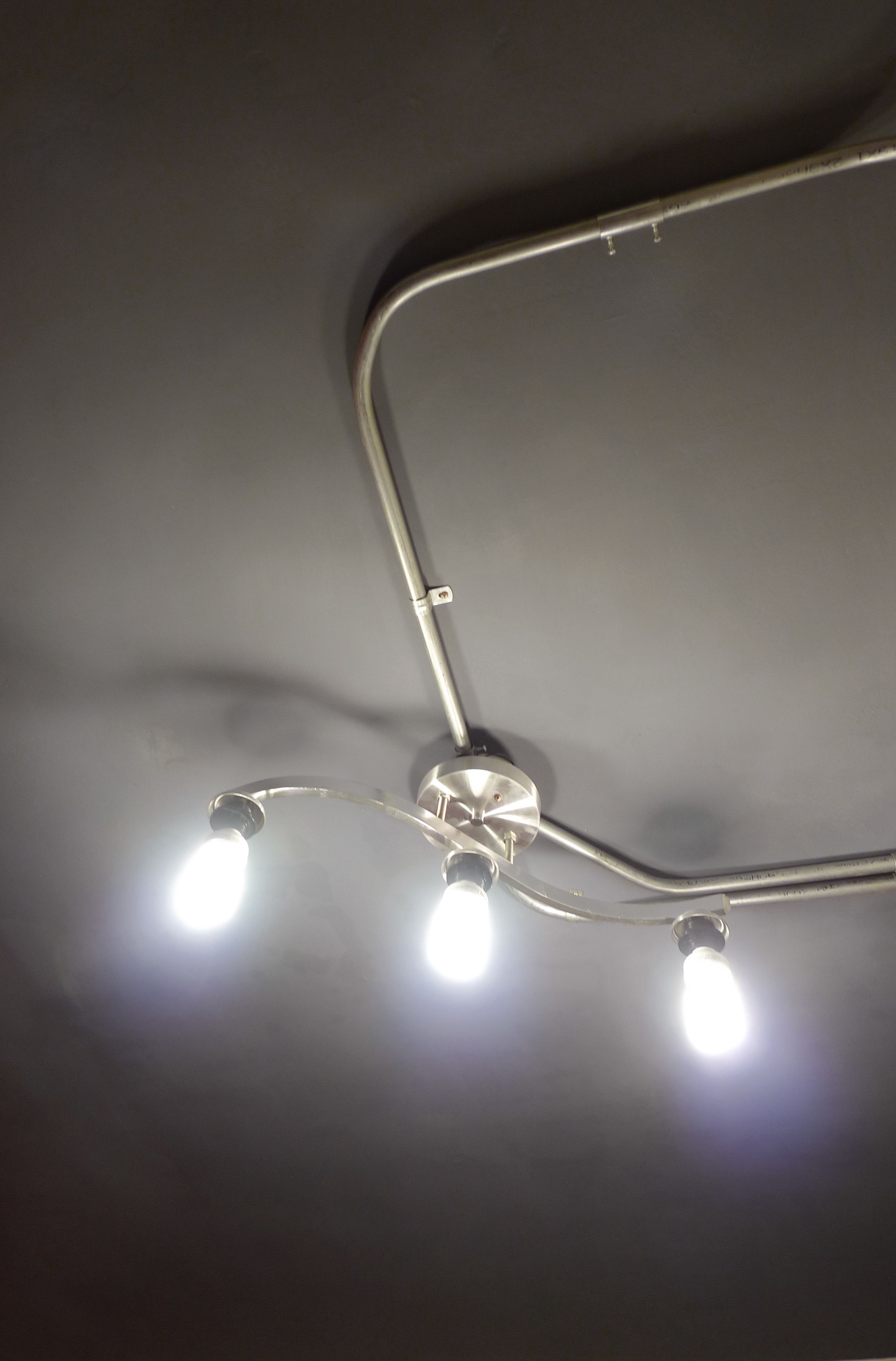 A ceiling with three light fixtures.