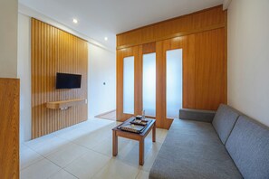 Signature Suite, Kitchen | Living area | 32-inch LED TV with cable channels, TV - Bali True Living Apartment (Denpasar)