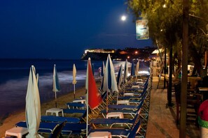 On the beach, sun loungers, beach umbrellas, beach bar