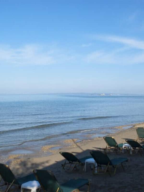 On the beach, sun-loungers, beach umbrellas, beach bar