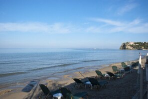 On the beach, sun loungers, beach umbrellas, beach bar