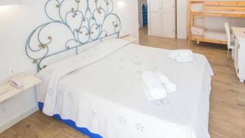 Quadruple Room | Minibar, in-room safe, desk, soundproofing