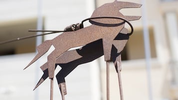 A metal sculpture of a horse.