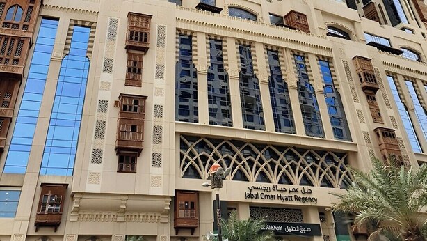 A multi-story building with a modern architectural design, featuring large windows and decorative elements. - Jabal Omar Hyatt Regency Makkah (Makkah)