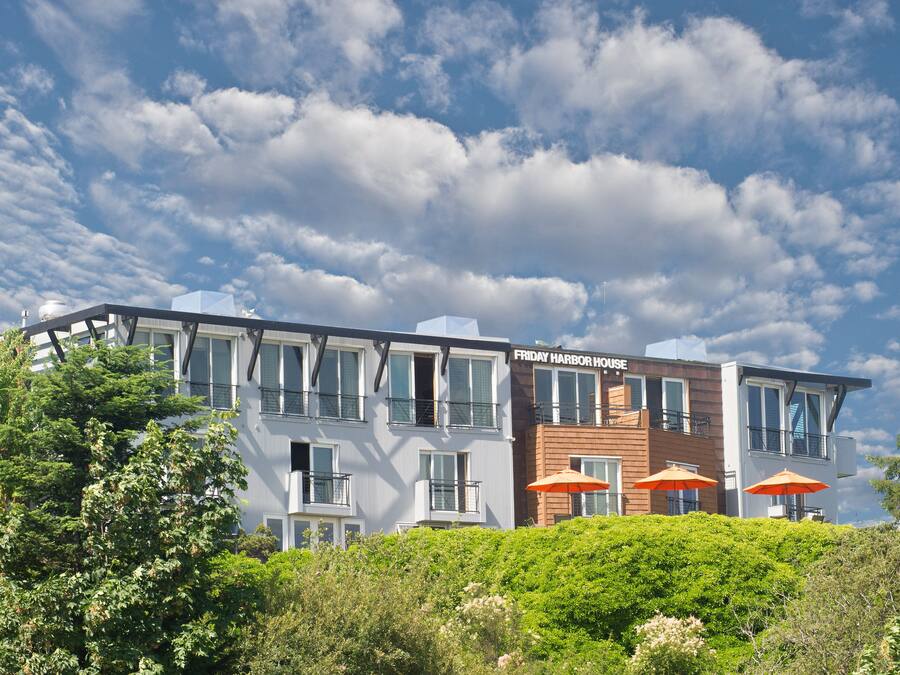 A multi-story building with a sign reading "Friday Harbor House."
